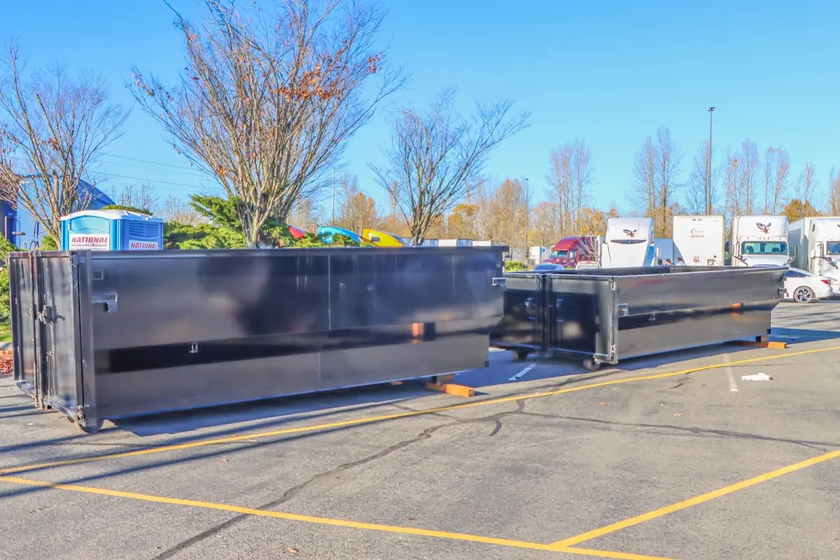 Professional dumpster rental service with roll-off container on residential driveway in Cherryville